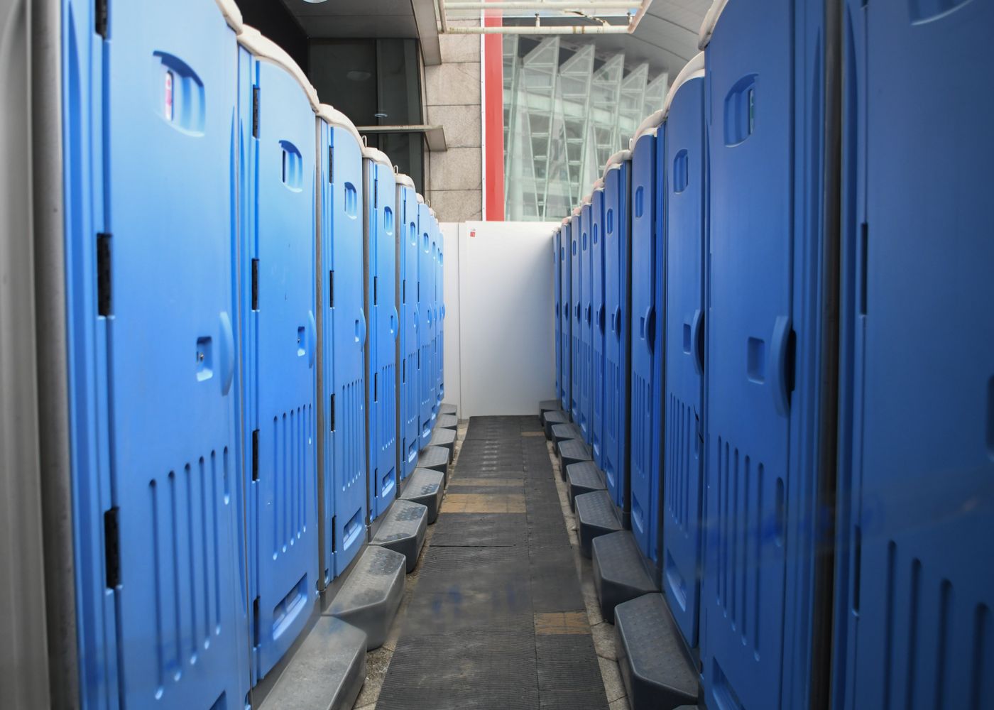 Representative row of portable toilets at a construction site